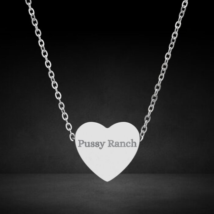 Heart-shaped necklace with engraved text.